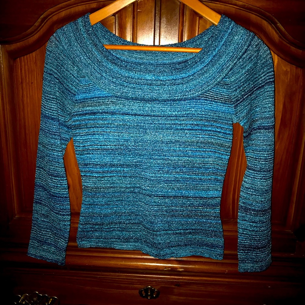 Size 8 stretchy shirt that can be worn off the shoulders or not.